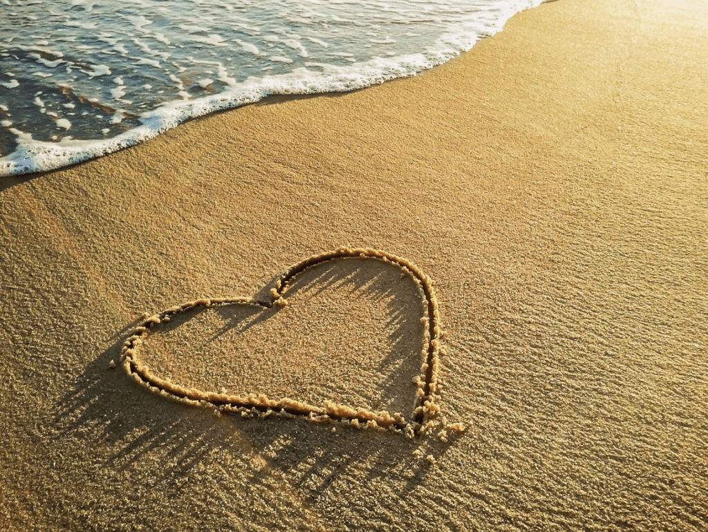 heart carved into the sand