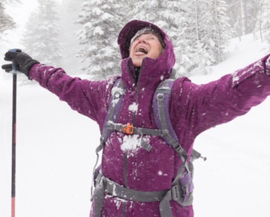 happy woman on cross country skis